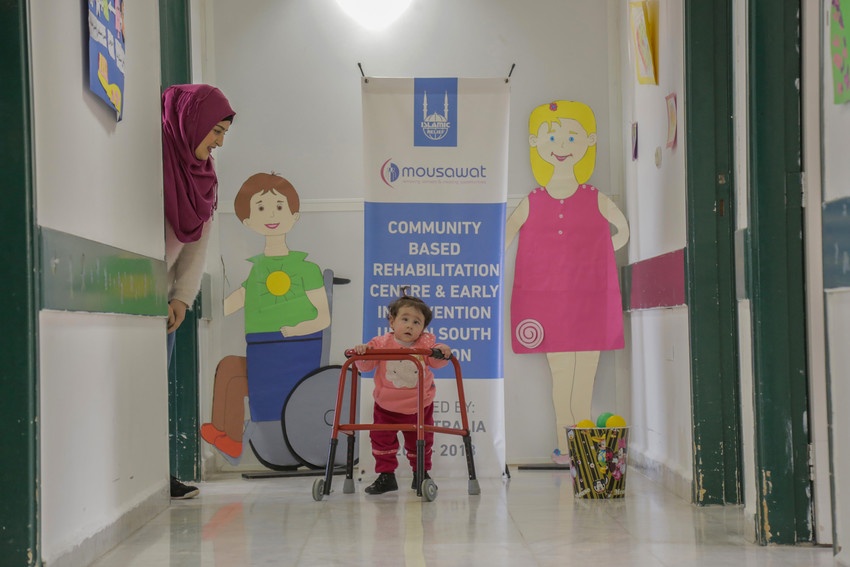 Young Child Girl use the Walker 