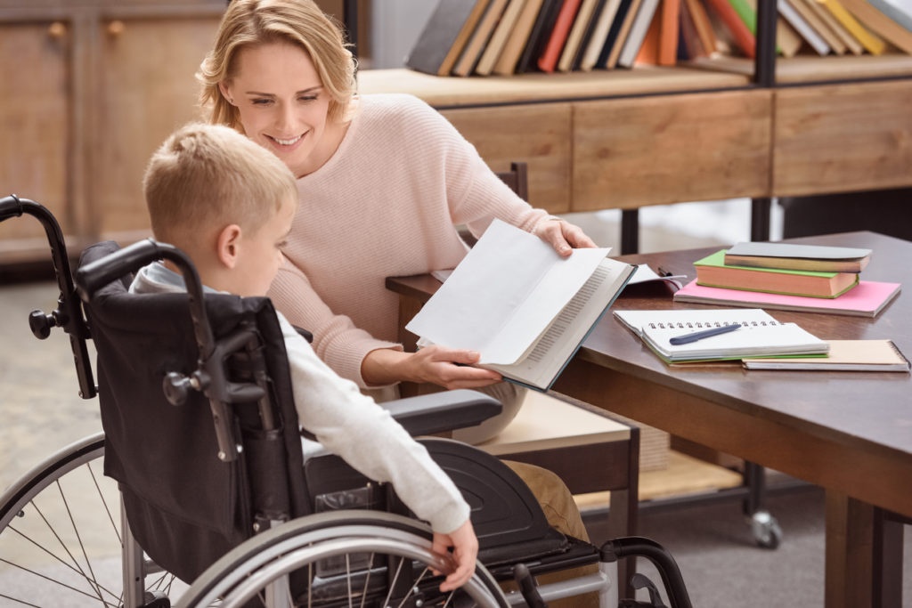 Child with Motor Disability study with his Teacher 